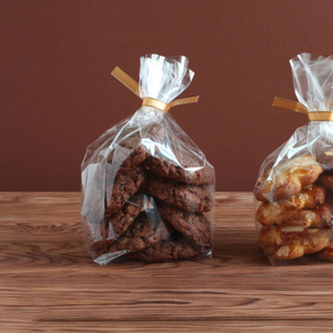 Sacs à biscuits biodégradables en PLA transparent décoratif avec ruban de vente de pâtisserie pour biscuits au chocolat
